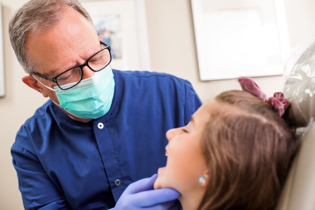 Dr. William Parr examining child Pediatric Dentistry